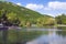 Lake Yotnabyur near the Hyatt Place Jermuk hotel. Green scenic mountains and clear blue sky. Armenia