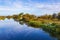 Lakeshore on the late summer with water reflections