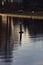 Lakeshore in a residential area at sunset with reflection casted in the water