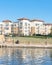 Lakeside apartment building complex with blue sky in America