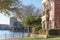 Lakeside apartment building complex with blue sky in America