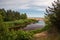 lakeside beach details with sand, rocks and blur background