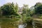 Lakeside building in woods on sunny day