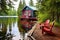 lakeside cabin with a red canoe at its dock