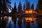 lakeside cabin with warm lights on during twilight