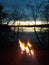 Lakeside campfire at sunset on Minnesota lake