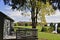 A lakeside cottage with the view of the lake and a walkout deck