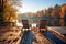 lakeside deck with empty chairs in autumn