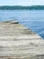 Lakeside dock boards sun warped in need of repair