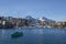 Lakeside homes and sailboat seen from a cruise boat at Lake Thun, Switzerland, Europe