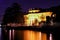 Lakeside mansion at night