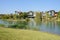 Lakeside modern houses in plants and trees of winter afternoon