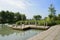 Lakeside pier in countryside of sunny summer morning