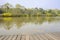 Lakeside planked footpath in sunny spring