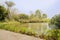 Lakeside planked path in sunny spring