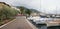 Lakeside promenade salo with moored sailboats