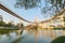 Lakeside scenery under Bhumibol Bridge or Industrial Ring Road with view of elevated highway interchange & bridge tower