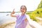 Lakeside Selfie Joy: Radiant Girl in Nature