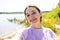 Lakeside Selfie Joy: Radiant Girl in Nature