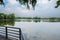 Lakeside steel railing of footbridge in city of cloudy summer af