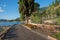 Lakeside walkway malcesine with wooden benches and flowerbed