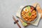 Laksa in gray bowl on concrete table top. Coconut noodle peranakan cuisine curry soup