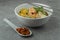 `Laksa Sarawak` is local dish famous in Sarawak Malaysia. Serve in white bowl over cement background