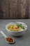 `Laksa Sarawak` is local dish famous in Sarawak Malaysia. Serve in white bowl over cement background