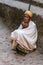 Lalibela, Ethiopia - Feb 13, 2020: Ethiopian people at the famous Rock-Hewn Church of Saint George - Bete Giyorgis