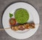 Lamb brochette marinated in spices, green semolina