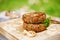 Lamb burgers spiced by mint and lamb rub on wood board