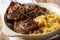 Lamb steak and spicy apple sauce close-up in a bowl. horizontal