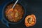 Lamb with vegetables and couscous on black background. Ramadan concept. Copy space