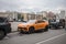 Lamborghini Urus parked on the street in Moscow. Orange supercar of old residential buildings