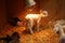 Lambs under heat lamp on straw white and black in box on farm new born