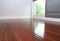 Laminate floor near windows, as interior design background.