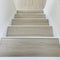 Laminate flooring Oak surface light grey color stairs. square .