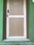 Laminated flush door with wooden frame for an room of an residential building or toilet area