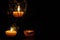 Lamp, candle shining in the darkness. Challis flame. Artistic composition. Lighting