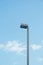 Lamp on pole on blue sky background bottom view