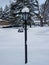 Lamp post in a bright snowy day