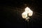 Lamp post on a dark snowy night