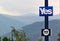 Lamp post with election posters of the referendum on Scottish independence, mountains, forest and trees