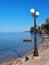 Lamp post on Nikolaiika Beach and the Corinthian Gulf in Greece