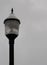 Lamp post on overcast day with copy space on right, vertical