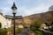 Lamp with signpost to porthmadog & Caernarfon on River bridge in Beddgelert, Wales