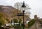 Lamp with signpost to porthmadog & Capel Curig on River bridge in Beddgelert, Wales