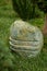 Lamp stone, with cuts.On the garden lawn