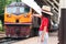 Lampang, Thailand - August 4, 2019: child is waiting for the train at train station