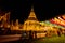 LAMPHUN, THAILAND - October 28, 2020 : Phra That Hariphunchai Pagoda with Lanna Style Lantern at Night